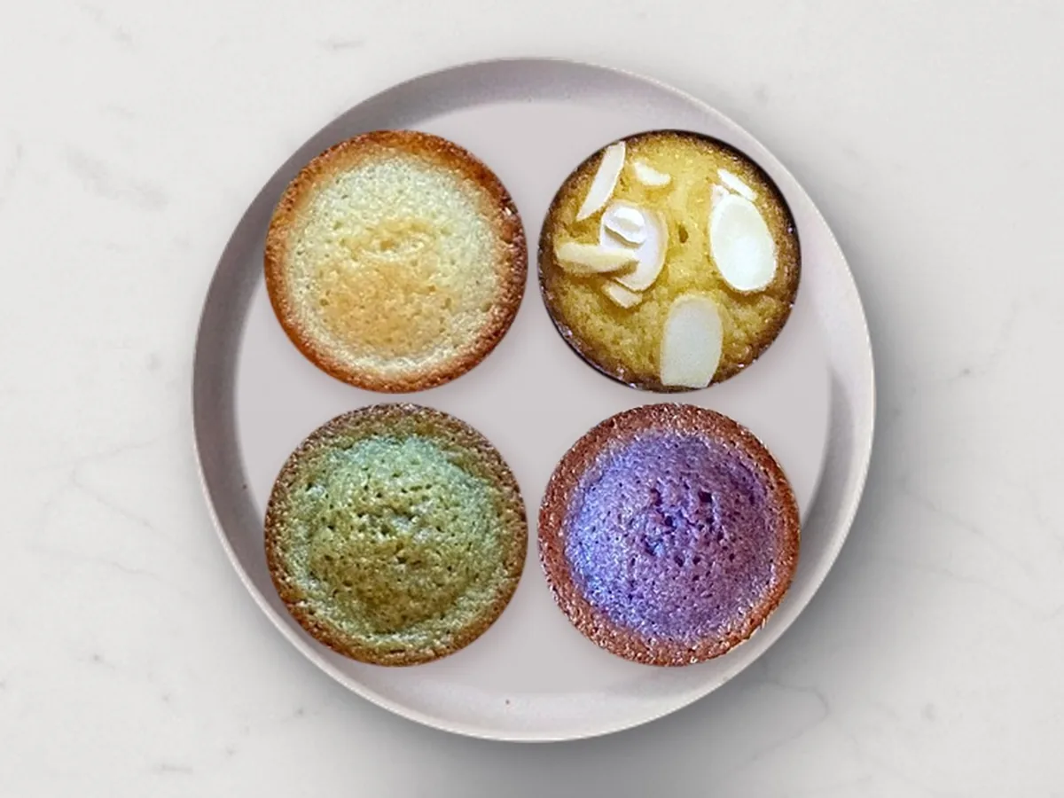 Four Mochi Bites on a plate: Classic Butter, Toasted Almond, Citrus Matcha and Velvety Ube